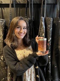 A photo of Kaia and a piece of art she made